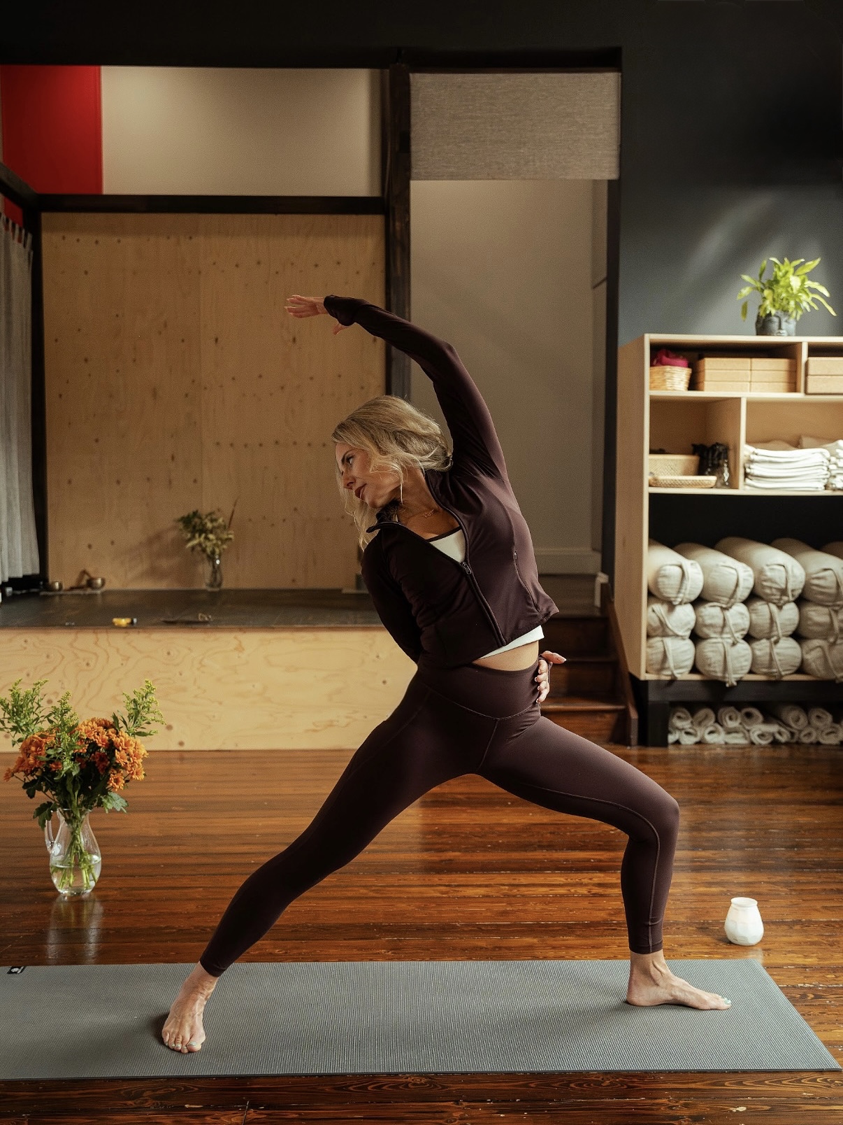 Kimberley in a warrior pose during a yoga practice