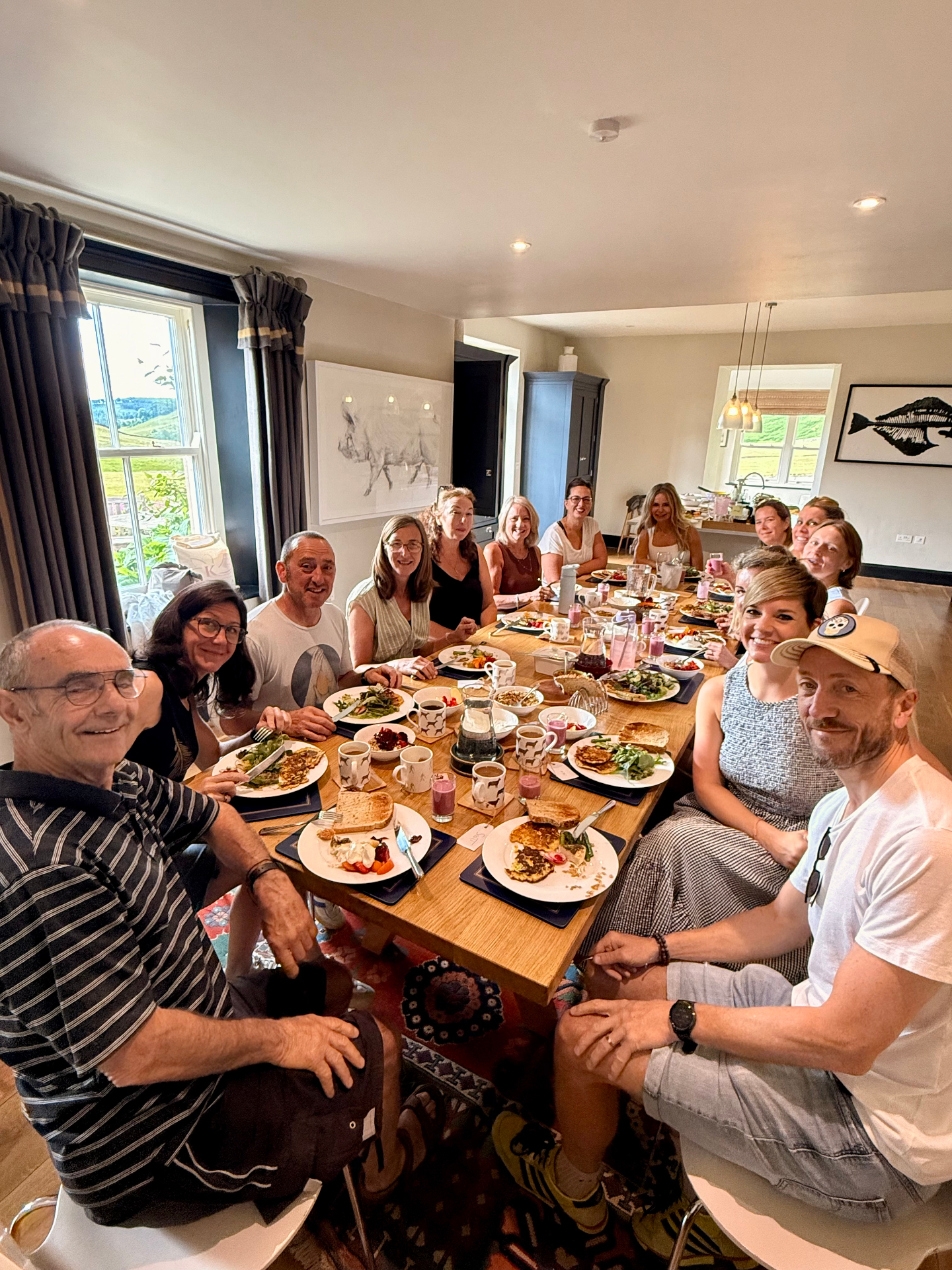 Guests sharing a long farmhouse table