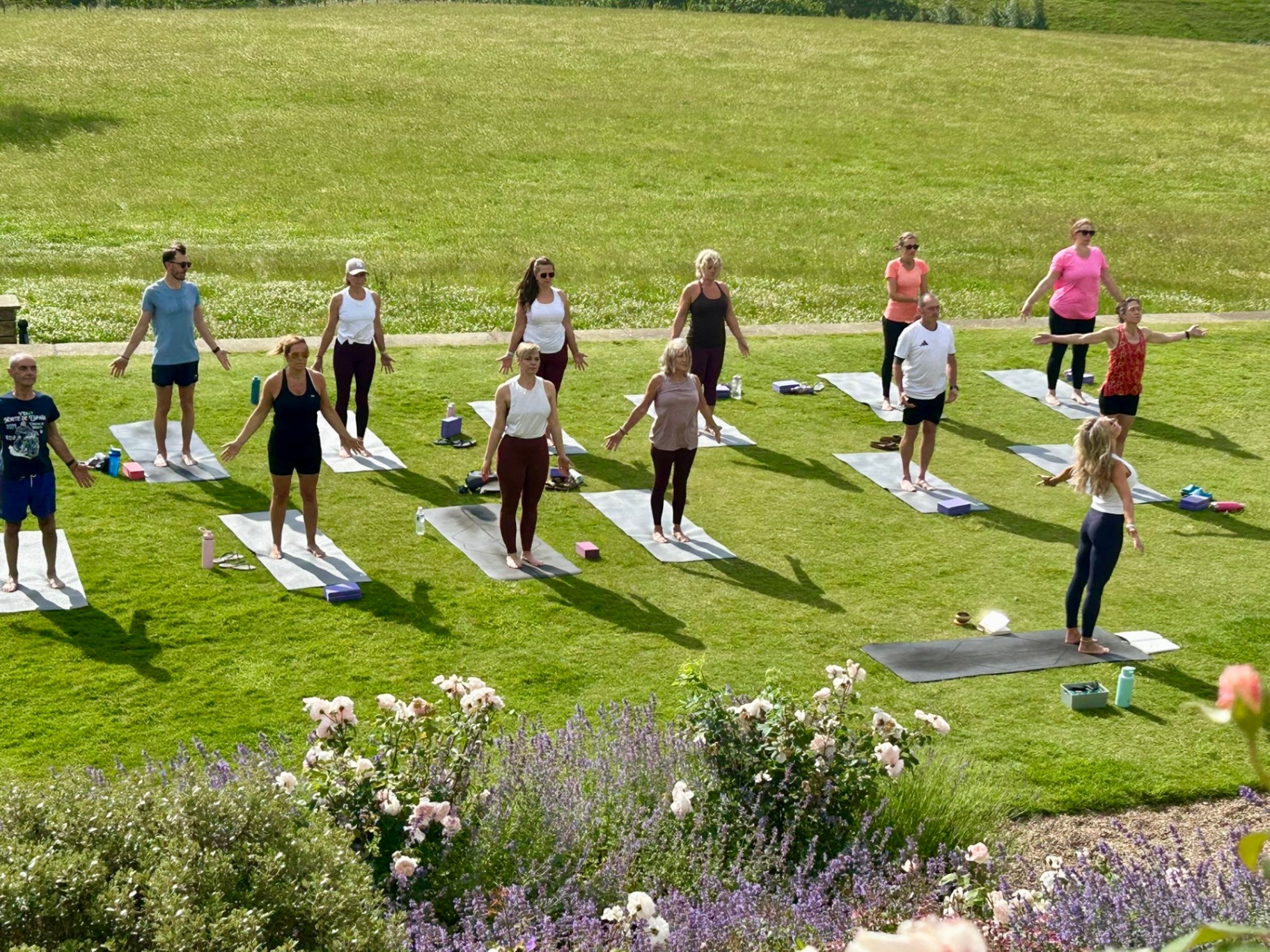Yoga practice on the lawn during a K Yoga retreat in Yorkshire